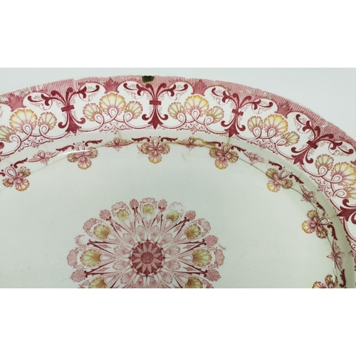 504 - A selection of antique dinnerware. To include a blue & white platter, a red & white platter (signifi... 