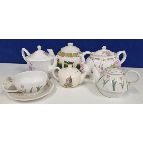 557 - A collection of teapots. Five examples in pastel tones. Includes a 'Royal Albert' 'Cosmos, October' ... 