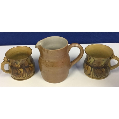 625F - Two vintage mugs from Gwili, together with a vintage French jug.