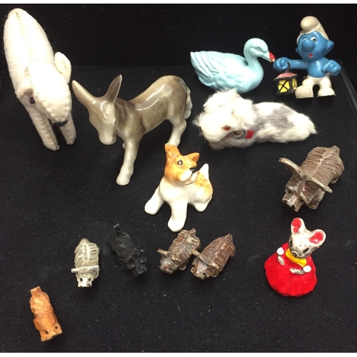 646 - A selection of vintage model animals. To include dogs (one made in W. Germany), donkey, lamb, Smurf ... 