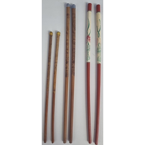 661 - Three sets of vintage 20th century wooden Oriental chopsticks, one pair being lacquered. Two sets ar... 