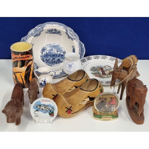 677 - A larger assortment of travel souvenirs & tourist pieces, to include treen animals & ceramics from J... 