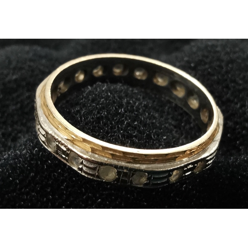 891 - A hallmarked 18ct gold eternity ring. Weight approx. 3g. Size N.