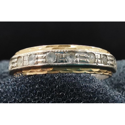 891 - A hallmarked 18ct gold eternity ring. Weight approx. 3g. Size N.