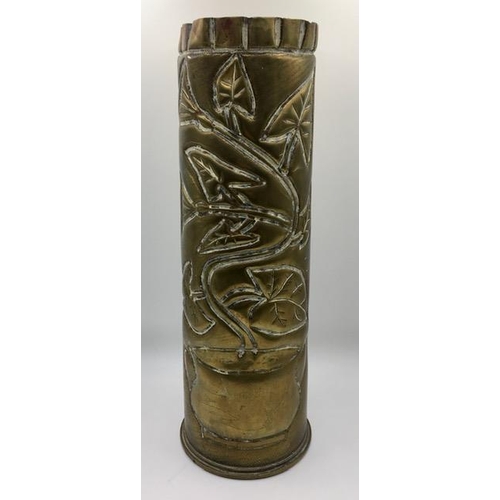 223 - Trench Art - A decorated WWI British brass shell case, engraved with a leafy-plant design. Length 29... 