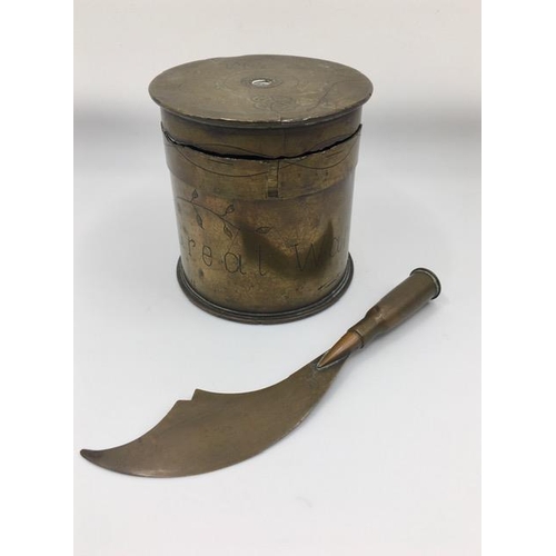 226 - Trench Art - A letter opener made from a bullet case, together with a lidded storage casket shell ca... 