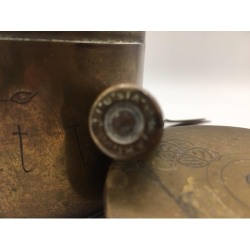 226 - Trench Art - A letter opener made from a bullet case, together with a lidded storage casket shell ca... 