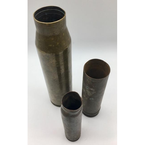 227 - A trio of spent brass shell cases.