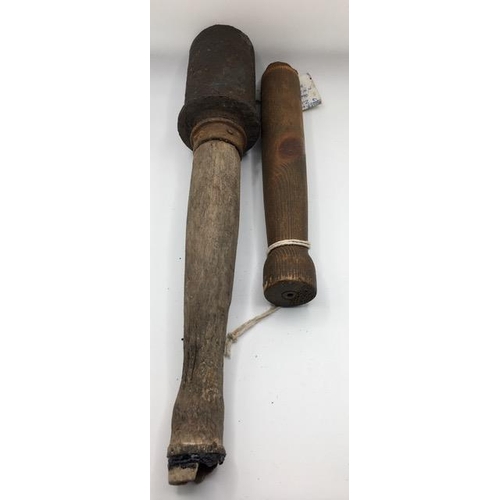 229 - A German WWI Stick Grenade, together with another handle only.