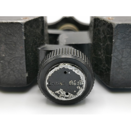 244 - A pair of early 20th century field binoculars (x6), by 'Negretti & Zambra - London'.