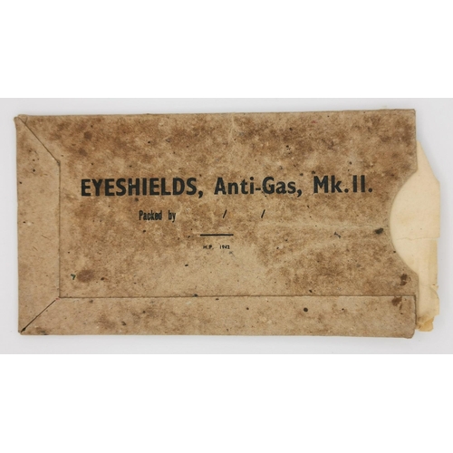 258 - A pair of WWII Anti-Gas Eyeshields, with original cardboard case. Manufactured 1942.