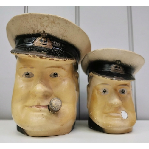 273 - Two Winston Churchill in naval uniform character jugs, each marked 'British Made'. The shorter havin... 