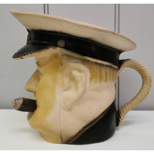 273 - Two Winston Churchill in naval uniform character jugs, each marked 'British Made'. The shorter havin... 