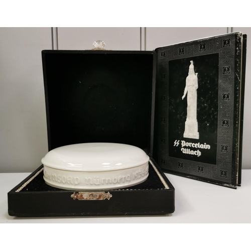 SS Allach Rally Bowl - An extremely rare, fine example of SS Allach porcelain. The white, lidded bowl was presented personally by Himmler to SS Officers at the 1936 Nuremberg rally. Complete with its original presentation case & a scarce copy of the book 'SS Porcelain Allach', referencing the bowl.