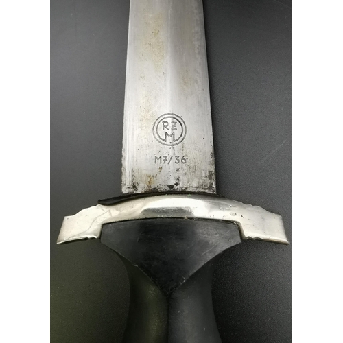 291 - A reproduction SS Dagger & matching Scabbard. Blade maker's mark' RZM M7/36' present. Blade length 2... 