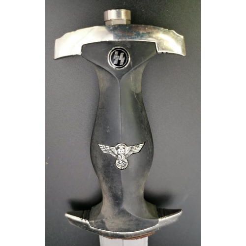 292 - A reproduction SS Dagger & matching Scabbard. Blade maker's mark' RZM M7/36' present. Blade length 2... 