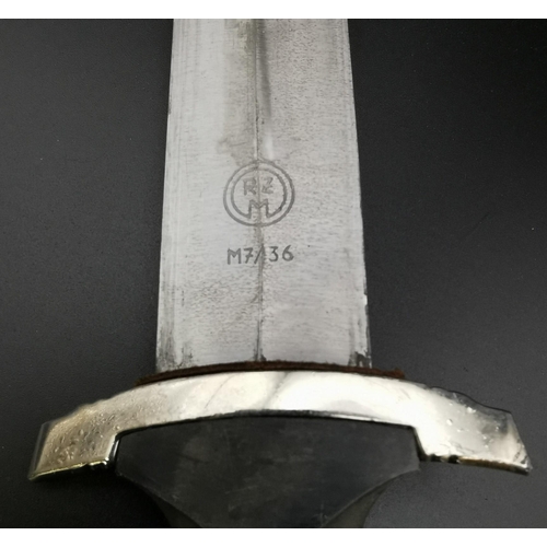 292 - A reproduction SS Dagger & matching Scabbard. Blade maker's mark' RZM M7/36' present. Blade length 2... 