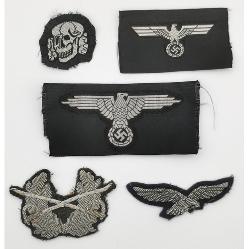 311 - A selection of five German Army cloth patches. To include Waffen SS sleeve patch (reproduction), M40... 