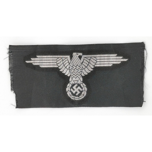 311 - A selection of five German Army cloth patches. To include Waffen SS sleeve patch (reproduction), M40... 