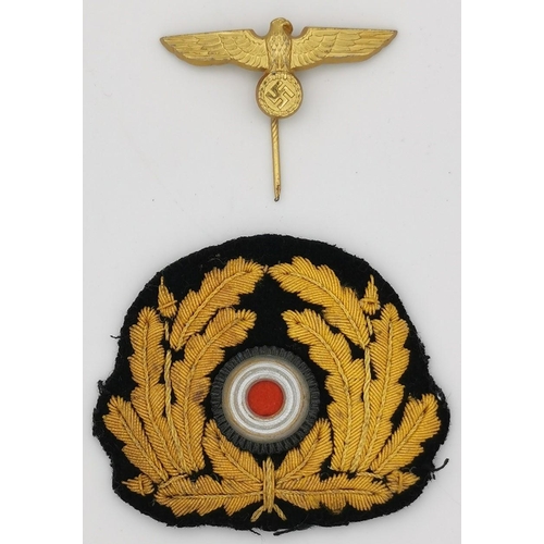 316 - A WWII German Kriegsmarine Officer's cap wreath/cockade & Eagle pin.