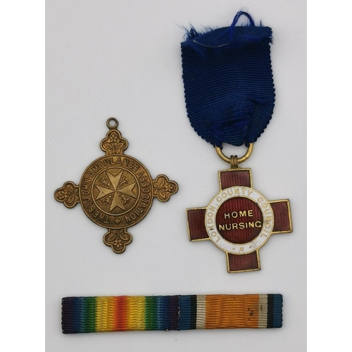 319 - A trio of British medals. To include St John Ambulance Association medal, London County Council Home... 