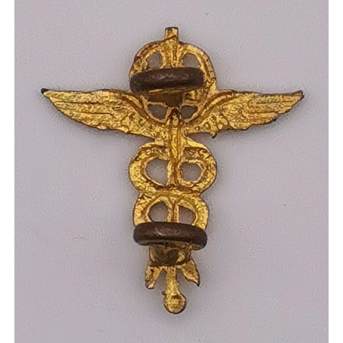 320 - An RAF Medical Services Corps Officer's collar pin, together with a London County Council First Aid ... 