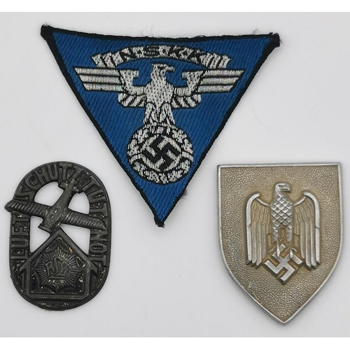 321 - A WWII German NSKK Overseas cap patch,  an Anti-Aircraft Air Defence badge (no badge bar) & an army ... 