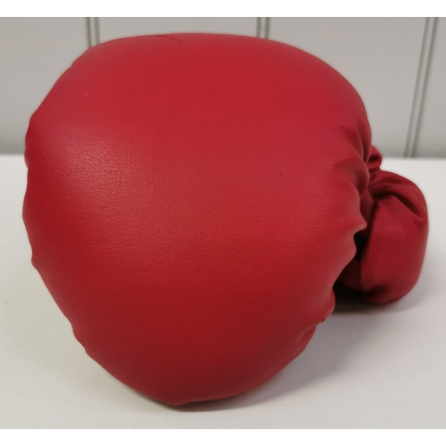 471 - An Everlast boxing glove, with certificate of authenticity, signed by Henry Cooper (British 1934-201... 