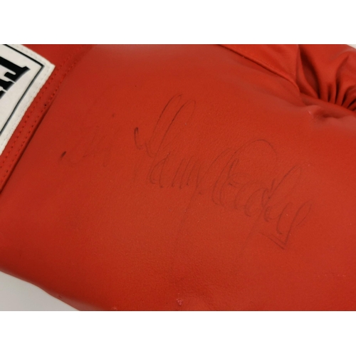 471 - An Everlast boxing glove, with certificate of authenticity, signed by Henry Cooper (British 1934-201... 