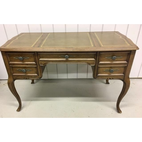 74 - A Louis XV style, walnut desk. Features a false fronted filing drawer, central drawer & two further ... 