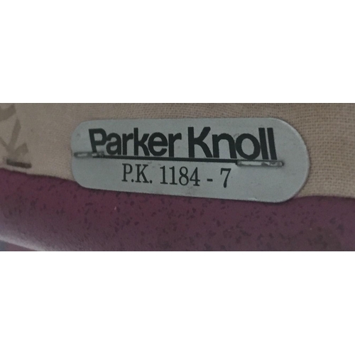 138 - A Parker Knoll mauve coloured tub chair (model P.K. 1184-7) with matching footstool (model P.K. 1240... 