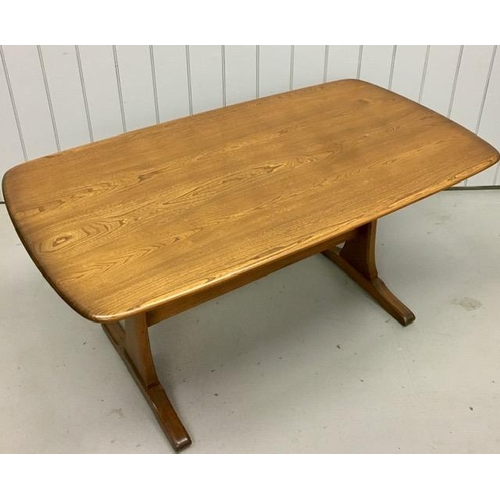 93 - An Ercol dark elm rectangular dining table. Dimensions(cm) H73, W153, D85.