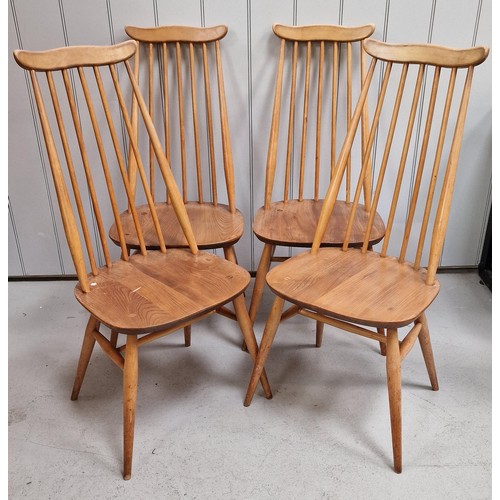 A set of four Ercol Blonde Goldsmith high-backed chairs. Dimensions(cm) H100(42 to seat), W42, D50.