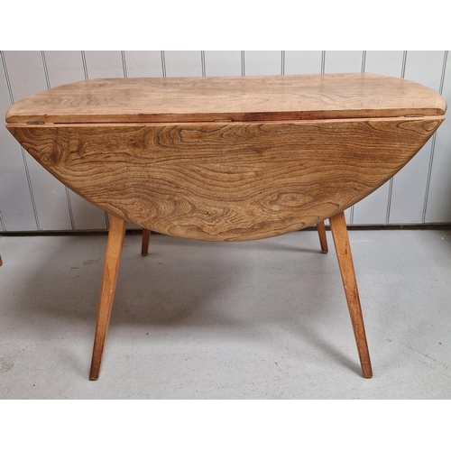 95 - An Ercol Blonde drop-leaf dining table. Dimensions(cm) H72, W113, D66/126.