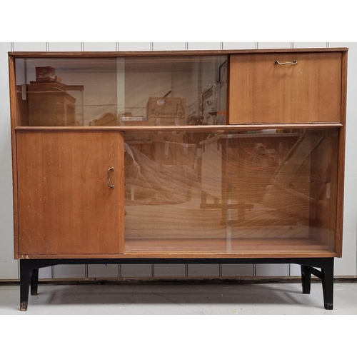 100 - An early 'Nathan' teak bookcase/cabinet, with two sets of glazed sliding doors. Dimensions(cm) H97, ... 