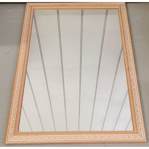 102 - A pretty-framed wall mirror. Dimensions 60cm x 85cm.