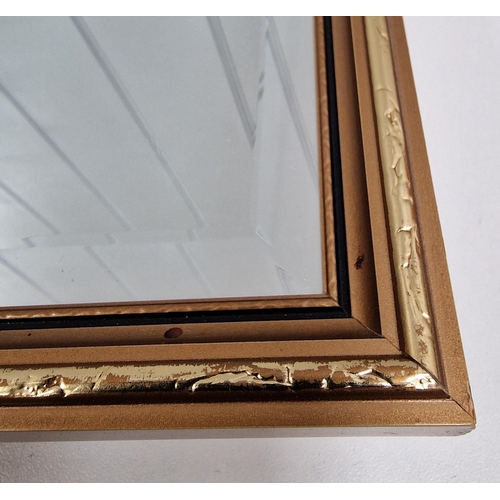 108 - A retro bevelled-edged wall mirror, in part-gilded frame. Dimensions 63cm x 44cm.