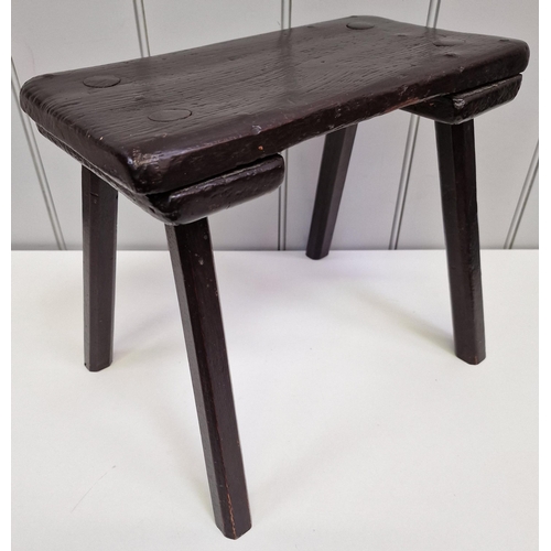 117 - A handmade, antique, four-legged milking stool. Dimensions(cm) H30, W36, D27.