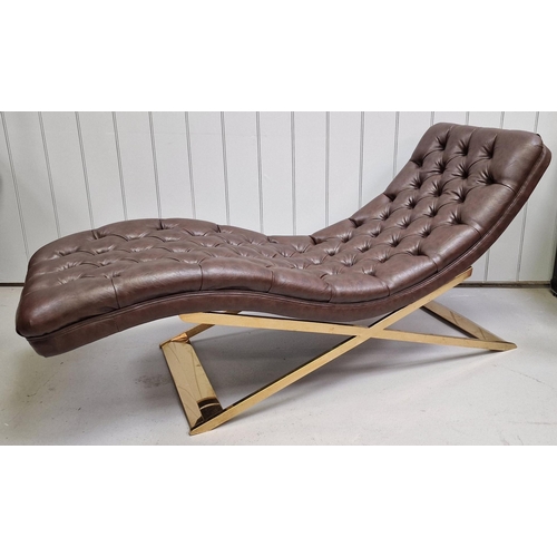 A stylish, contemporary chaise longue. Upholstered in brown buttoned leather, supported by a gold-coloured frame. Dimensions(cm) 80 (42 to seat), W164, D58.