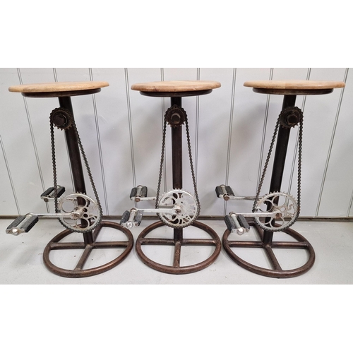 122 - A superb set of three 'bicycle pedal' kitchen stools. Each has a wooden seat, rustic steel base & (s... 