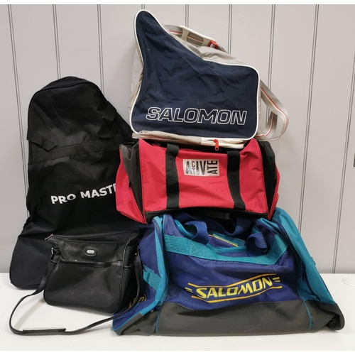 733 - A selection of five vintage sports bags. To include 'Salomon' ski boot bags & a Pro-Master Plus golf... 