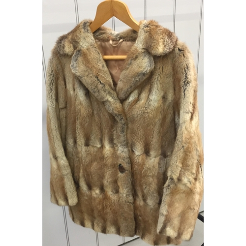 833 - A vintage fur coat, made by 'M Michaels of Exeter & Torquay'. Original purchase cost exceeded £300.