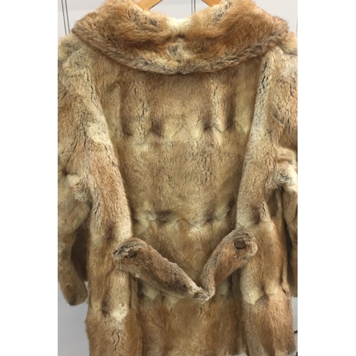 833 - A vintage fur coat, made by 'M Michaels of Exeter & Torquay'. Original purchase cost exceeded £300.