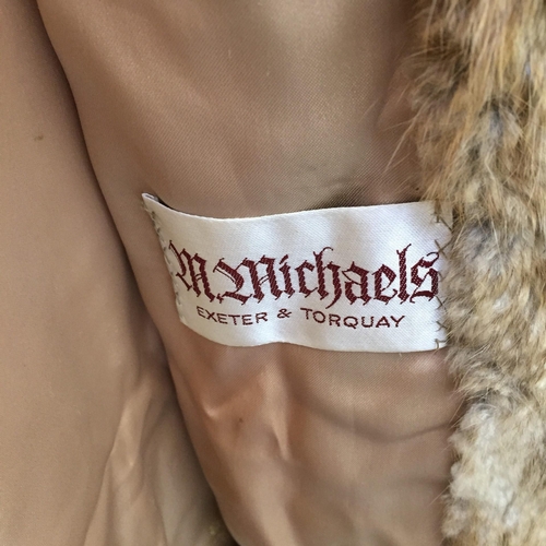 833 - A vintage fur coat, made by 'M Michaels of Exeter & Torquay'. Original purchase cost exceeded £300.