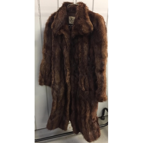 834 - A vintage fur coat from G H Lee & Co Ltd, Liverpool.