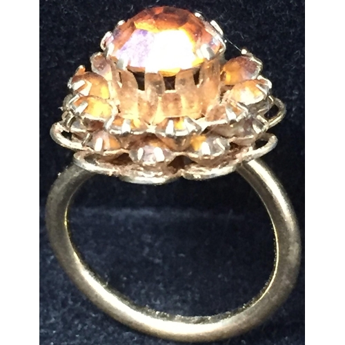 856 - Two, vintage 'Sarah Cov.' items. To include a sunflower gold-plated brooch, together with a cluster ... 