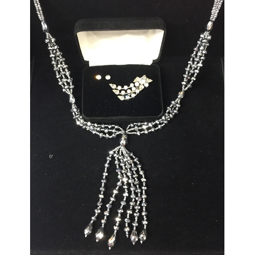 858 - A pretty white metal brooch & earrings set, together with a white metal multi-strand necklace.