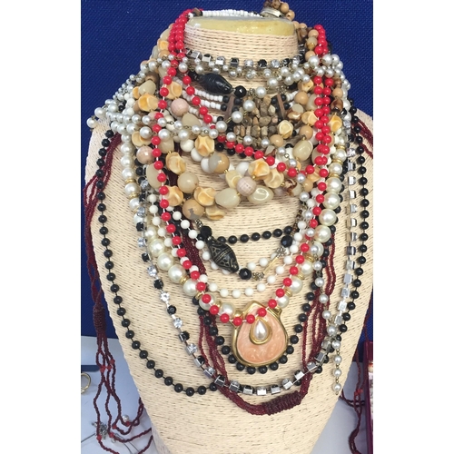 853 - A large collection of costume jewellery. To include necklaces (20+), earrings/brooches/pins (20+), e... 