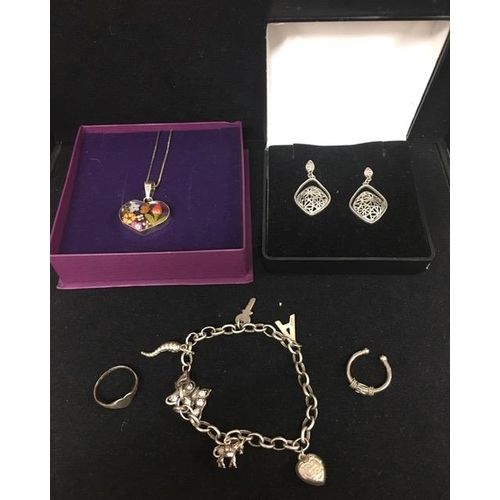 864 - A selection of hallmarked silver jewellery. To include a body ring, floral heart-shaped pendant & ch... 