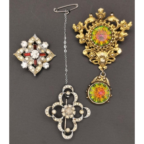 868 - A collection of four pretty brooches. To include a silver bouquet example, together with three other... 